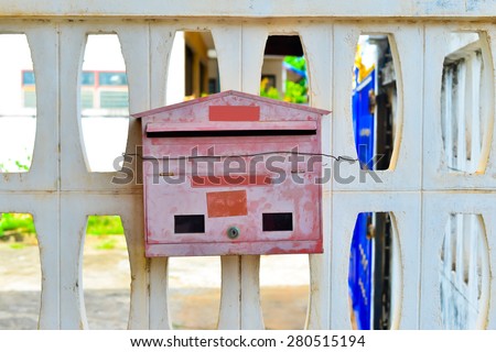 Old red post box or mailbox postbox letterbox on the street