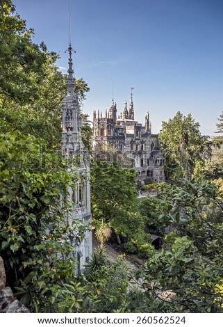 Portugal , Sintra . Palace Regaleira is typical Gothic architectural elements , such as turrets, gargoyles, and a tower in the shape of an octagon. Magnificent park .
