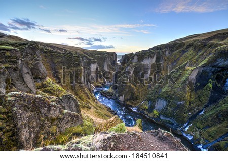 Fjadrargljufur canyon in southeast Iceland which is up to 100m deep and about 2 km long, with the Fjadra river flowing through it. It is near the Ring Road, by the village of Kirkjubaejarklaustur.