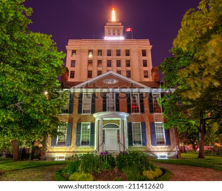 TORONTO, CANADA - JUNE 14, 2014: A frontal view of the Campbell House Museum at night in Toronto. The Campbell House is the oldest remaining house from the original site of the Town of York.