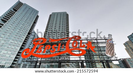 NEW YORK - MARCH 23, 2014: Landmark Pepsi Cola sign in Long Island City on March 23, 2014. This historic 147 foot sign once on the Pepsi Factory is now located at Gantry Plaza State Park in Queens.