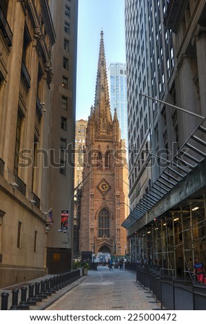 NEW YORK, NEW YORK - SEPTEMBER 27, 2014: Trinity Church, New York City. USA as seen from Wall Street.
