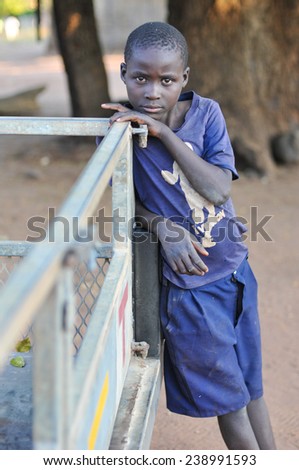 MIKUNI VILLAGE, ZAMBIA - APRIL 22, 2012: Unidentified boy from Mikuni Village, Zambia outside of Livingstone, Southern Zambia.