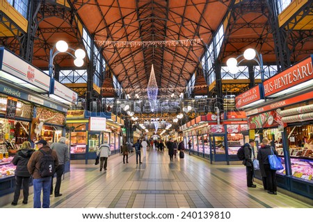 BUDAPEST, HUNGARY - DECEMBER 1, 2014: People shopping in the Great Market Hall in Budapest, Hungary. Great Market Hall is the largest indoor market in Budapest and was built in 1896.