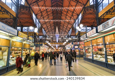 BUDAPEST, HUNGARY - DECEMBER 1, 2014: People shopping in the Great Market Hall in Budapest, Hungary. Great Market Hall is the largest indoor market in Budapest and was built in 1896.