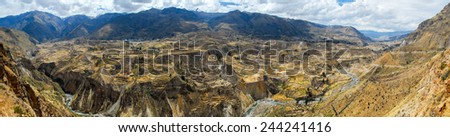 Panoramic view of Colca Canyon, Peru, South America. The Incas built farming terraces with ponds over the cliff. One of the deepest canyons in the world.