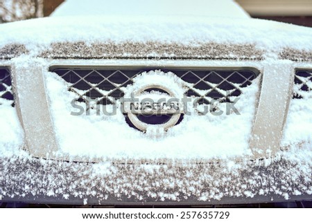 BROOKLYN, NEW YORK - MARCH 1, 2015: Front end of a Nissan pickup truck during a winter storm.