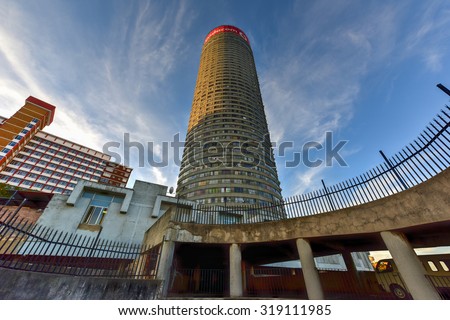 Johannesburg, South Africa - May 25, 2015: Ponte City Building at sunset. Ponte City is a famous skyscraper in the Hillbrow neighbourhood of Johannesburg.
