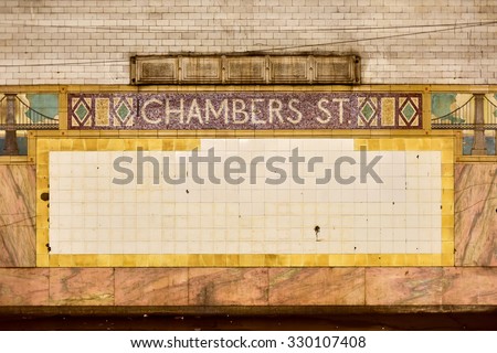 New York, USA - May 30, 2015: Chambers Street Subway Station in Manhattan. Intricate tiles with symbols of the Brooklyn Bridge in terra cotta.