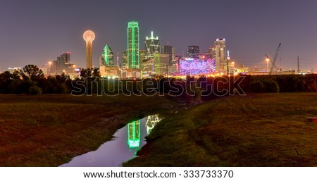 Downtown Dallas skyline at night from the Trinity River in Texas, USA.