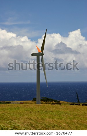 Wind turbine, part of a larger wind farm. North side of Hawaii Island. Pacific Ocean in the background