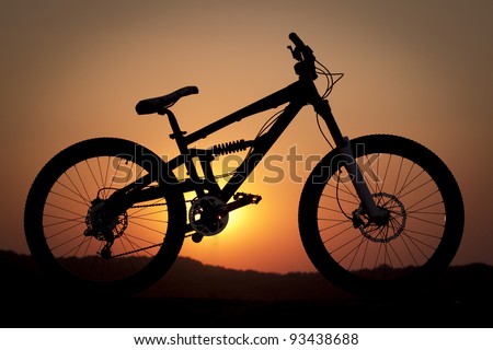 A silhouette of a mountain bike