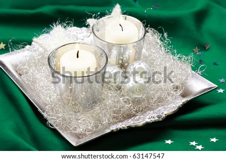 Silver, baroque Christmas candle, still life.