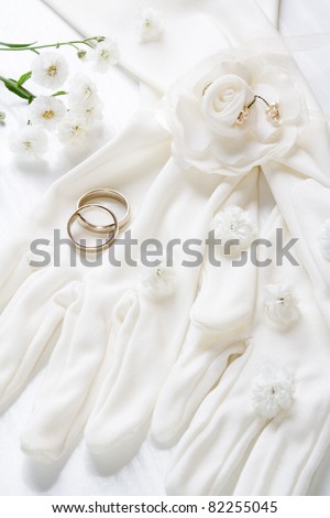 Bridal gloves, vintage accessories with wedding bands. Romantic wedding background, still life.
