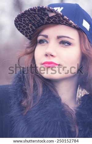 Beautiful young woman in her baseball cap. Outdoor beauty fashion vintage-retro image. / Leopard pattern baseball cap / Beautiful woman in her baseball cap. Outdoor beauty fashion vintage-retro image
