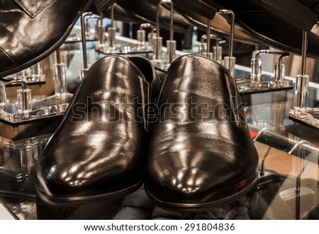 Set of black and brown mens luxury shoes in the store