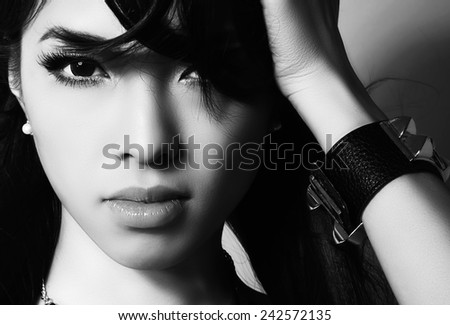 beautiful asian woman with perfect skin in black and white
