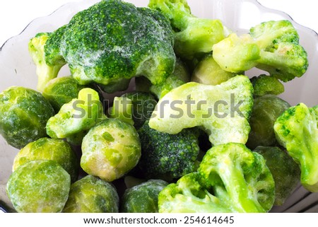Broccoli and Brussels sprouts on the plate on the white background