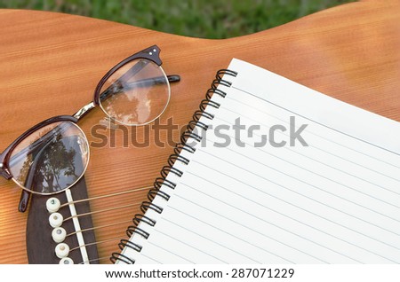 Blank paper for writing music on guitar.