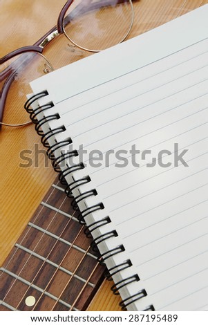 Blank paper for writing music on guitar.
