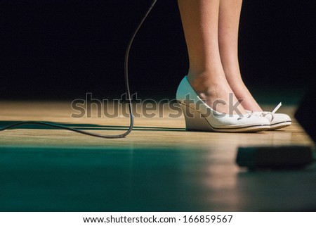 Woman feet with shoes on stage