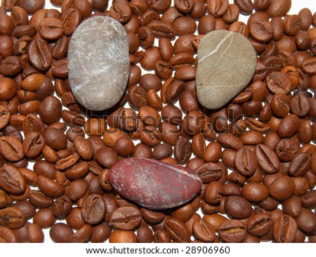 Beauty background of beans coffee and face of stones.