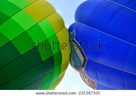 Putrajaya,Malaysia - March 29, 2013: There are two hot air ballons kiss together in Putrajaya International Hot Air Balloon Fiesta 2013 in Putrajaya,Malaysia Description