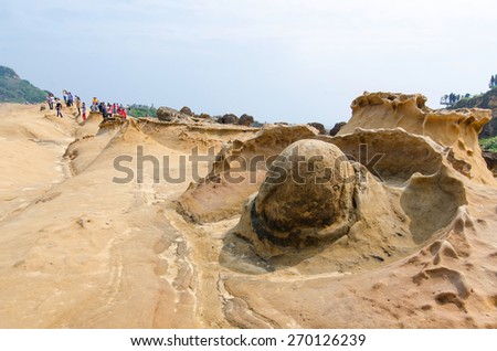 New Taipei City,Taiwan - March 15, 2015: Rock formation in Yehliu Geopark,Taiwan.People seen exploring around it.