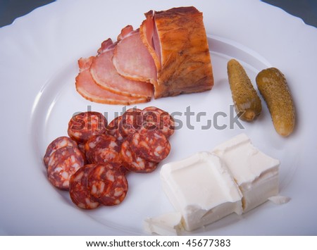 Ham, sausage, ham, cheese and  cucumber