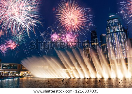 Fireworks over Dubai mall fountain show at night
