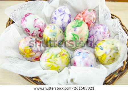 Bunch of hand colored Easter eggs in a egg basket