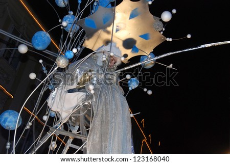 LJUBLJANA, SLOVENIA - DECEMBER 27: Good fairy, project by Zmago Modic, in front of Town hall fulfills children\'s wishes for New Year 2013. Ljubljana, Slovenia, on December 27, 2012.