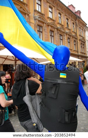 LJUBLJANA, SLOVENIA - JULY 2, 2014: Teatr Brovi from Ukraine with performance  Colored Men at traditional street theater festival Ana Desetnica. Story reflects the current situation in Ukraine.