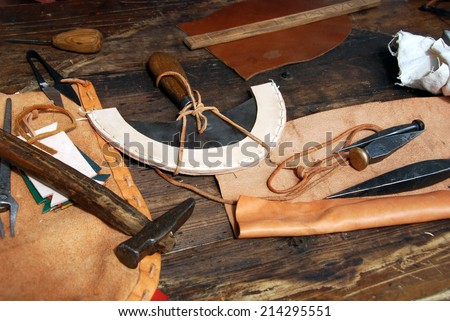LJUBLJANA, SLOVENIA - AUGUST 24, 2014: Leather dresser\'s tools (presented by historical society Legio I Italica) in a revived Roman military camp at celebration of 2000th anniversary of Emona.