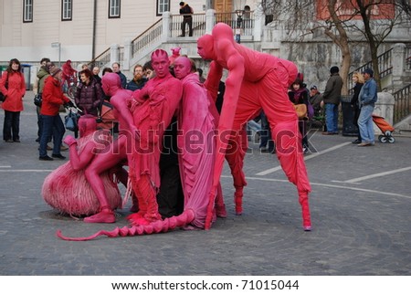LJUBLJANA, SLOVENIA - FEBRUARY 12: group LJUD from Slovenia as pink aliens took a walk through Ljubljana on February 12, 2011 in Ljubljana, Slovenia. Reaction at first contact with friendly aliens.