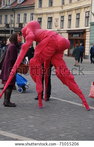 LJUBLJANA, SLOVENIA - FEBRUARY 12: group LJUD from Slovenia as pink aliens took a walk through Ljubljana on February 12, 2011 in Ljubljana, Slovenia. Reaction at first contact with friendly aliens.