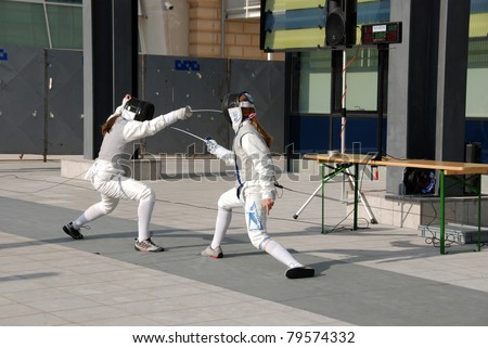 LJUBLJANA, SLOVENIA - JUNE 18: Two girls at presentation of fencing with foils at \
