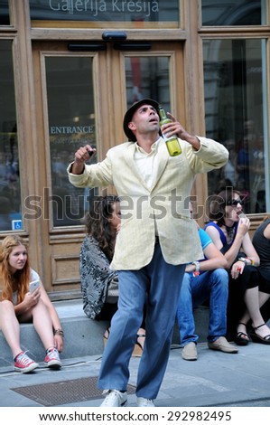 LJUBLJANA, SLOVENIA - JULY 1, 2015: 2 Faced Dance Company from Great Britain with a performance Two Old Men at traditional street theater festival Ana Desetnica. Break, street and contemporary dance.