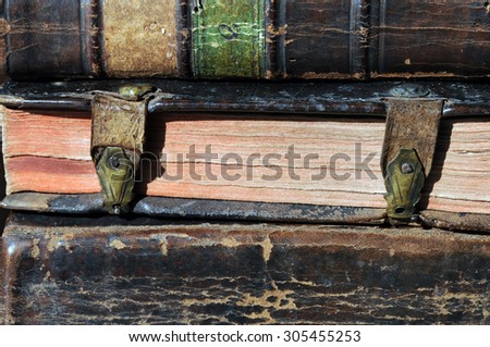Pile of antique books with clasps