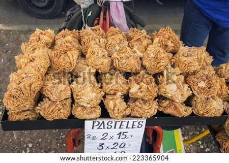 Rosario, Argentina - October 12, 2014: Traditional Argentinian fried cakes made of puff pastry and stuffed with sweet potato jelly are on sale on the sidewalk on October 12, 2014 in Rosario, Argentina