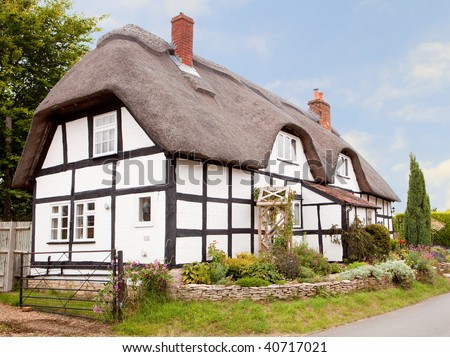 A traditional thatched cottage in an English village