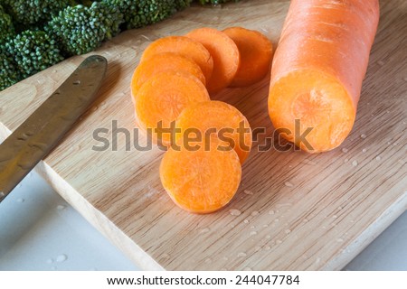 fresh carrot sliced on wooden background
