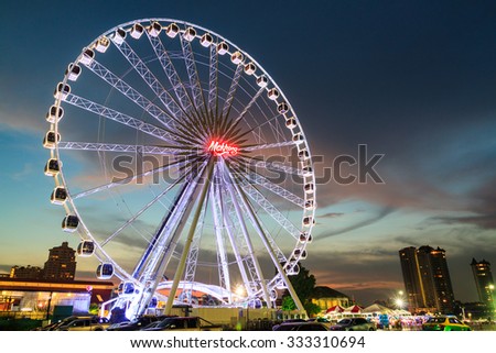 BANGKOK THAILAND - OCTOBER 29 : Ferris Wheel  in ASIATIQUE The Riverfront at twilight time , on October 29, 2015 in Bangkok, Thailand.