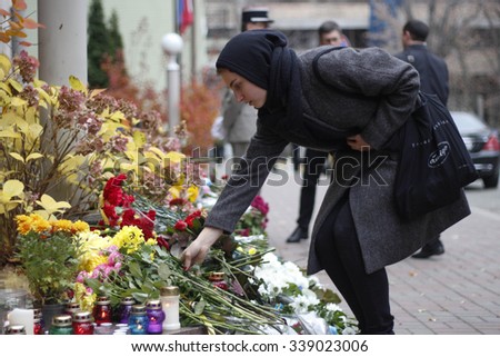 KIEV,UKRAINE - November 14, 2015: People lay flowers at the French Embassy in Kiev in memory of the victims of the November 13 terror attacks in Paris.