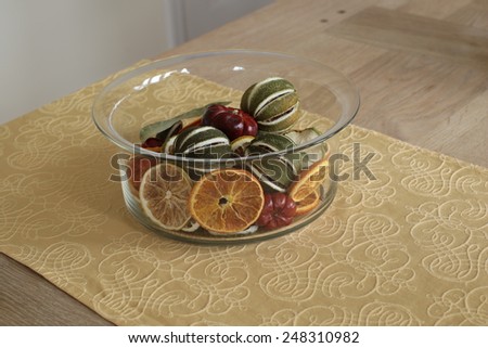 Bowl of sliced dried fruit on oak table