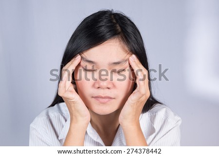 Asian women  have a sore eyes.
