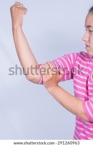 Young woman  a sore elbow.
