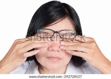 Asian women have a sore eyes.Isolated on white background.