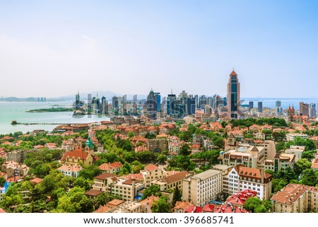 An Elevated view of Qingdao Skyline. Villa and Office Buildings, Skycarper near the sea. Qingdao is a famous tourist city in east China.