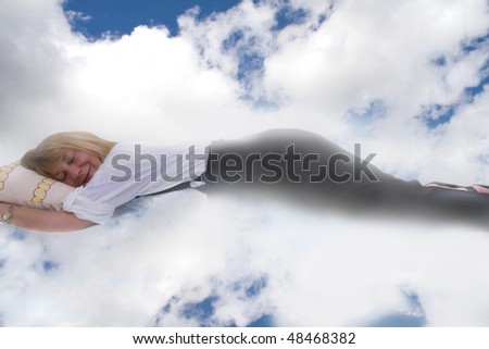 Beautiful lady sleeping in the clouds